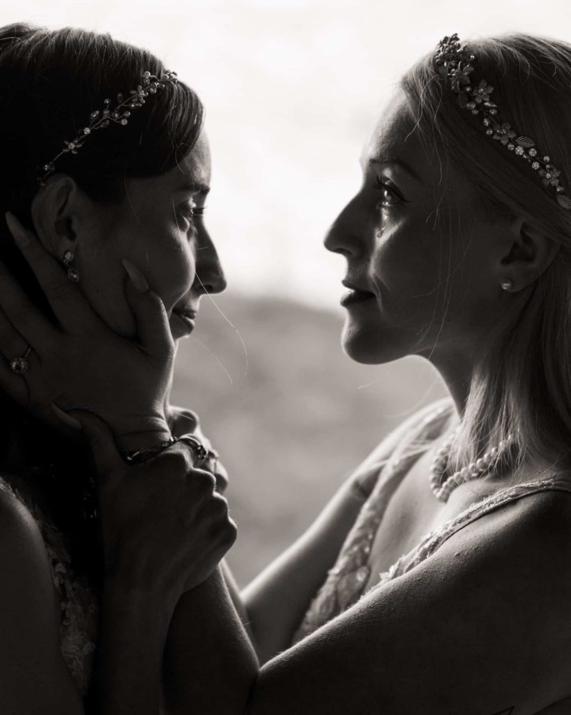 Photo of two beautiful women before the wedding having a meaningful moment